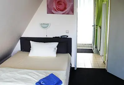 Ein Bett oder Betten in einem Zimmer der Unterkunft Apartment-Hotel-Dahlem