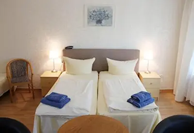 Ein Bett oder Betten in einem Zimmer der Unterkunft Apartment-Hotel-Dahlem