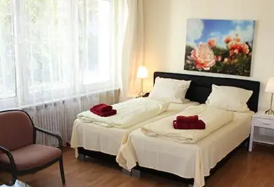 Ein Bett oder Betten in einem Zimmer der Unterkunft Apartment-Hotel-Dahlem