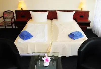Ein Bett oder Betten in einem Zimmer der Unterkunft Apartment-Hotel-Dahlem