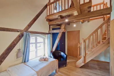 Ein Bett oder Betten in einem Zimmer der Unterkunft Zur Goldenen Kartoffel