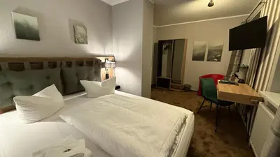 Ein Bett oder Betten in einem Zimmer der Unterkunft Hotel Annablick