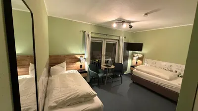 Ein Bett oder Betten in einem Zimmer der Unterkunft Hotel Annablick