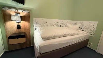 Ein Bett oder Betten in einem Zimmer der Unterkunft Hotel Annablick