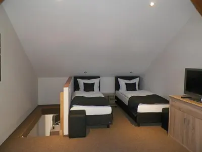 Ein Bett oder Betten in einem Zimmer der Unterkunft Landhotel zum Baggernpuhl
