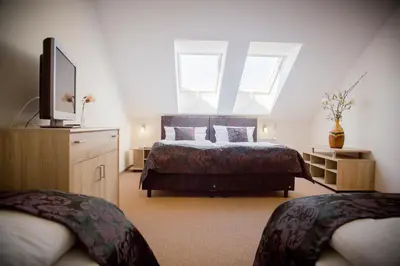 Ein Bett oder Betten in einem Zimmer der Unterkunft Landhotel zum Baggernpuhl
