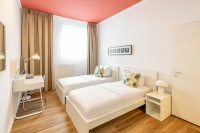 Ein Bett oder Betten in einem Zimmer der Unterkunft Midi Inn Parkhotel Mitte