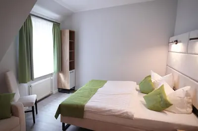 Ein Bett oder Betten in einem Zimmer der Unterkunft Hotel und Restaurant Kranichsberg