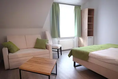 Ein Bett oder Betten in einem Zimmer der Unterkunft Hotel und Restaurant Kranichsberg
