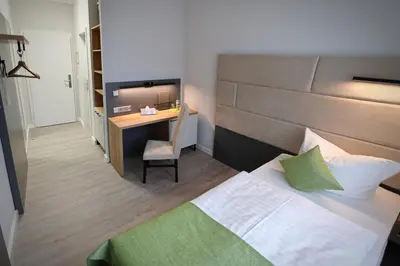 Ein Bett oder Betten in einem Zimmer der Unterkunft Hotel und Restaurant Kranichsberg