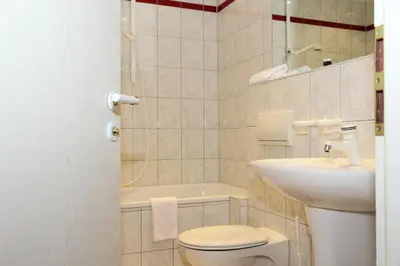 Ein Badezimmer in der Unterkunft Hotel und Restaurant Kranichsberg