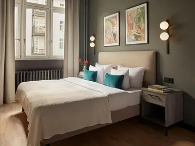Ein Bett oder Betten in einem Zimmer der Unterkunft Numa Berlin Sketch