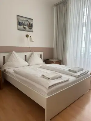 Ein Bett oder Betten in einem Zimmer der Unterkunft Erlanger Hof