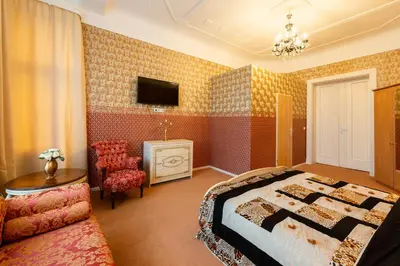 Ein Bett oder Betten in einem Zimmer der Unterkunft Hotel Pension Dahlem