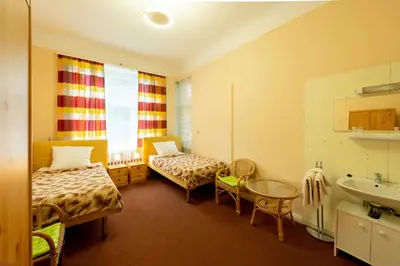 Ein Bett oder Betten in einem Zimmer der Unterkunft Hotel Pension Dahlem