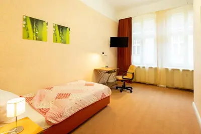 Ein Bett oder Betten in einem Zimmer der Unterkunft Hotel Pension Dahlem