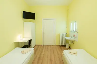 Ein Bett oder Betten in einem Zimmer der Unterkunft Hotel Pension Dahlem