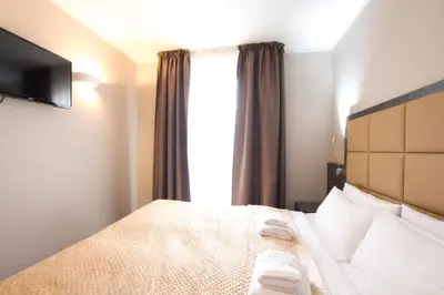 Ein Bett oder Betten in einem Zimmer der Unterkunft Hotel Delta am Potsdamer Platz