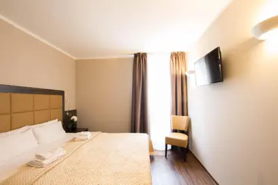 Ein Bett oder Betten in einem Zimmer der Unterkunft Hotel Delta am Potsdamer Platz