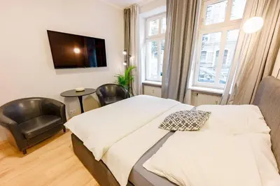 Ein Bett oder Betten in einem Zimmer der Unterkunft Cozy Studio Apartments In Berlin Prenzlauer Berg