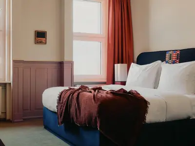 Ein Bett oder Betten in einem Zimmer der Unterkunft The Dean Berlin