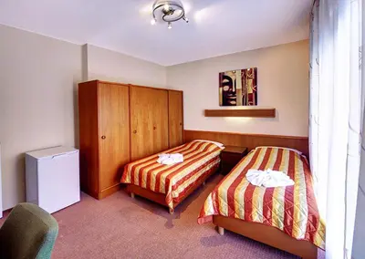 Ein Bett oder Betten in einem Zimmer der Unterkunft Hotel Kallmeyer