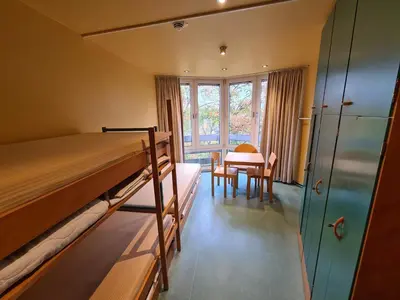 Ein Bett oder Betten in einem Zimmer der Unterkunft Jugendgästehaus St.-Michaels-Heim
