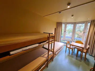 Ein Bett oder Betten in einem Zimmer der Unterkunft Jugendgästehaus St.-Michaels-Heim