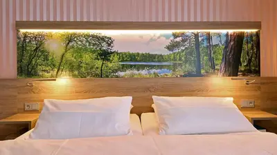 Ein Bett oder Betten in einem Zimmer der Unterkunft Hotel & SPA Sommerfeld - Adults Only