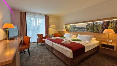 Ein Bett oder Betten in einem Zimmer der Unterkunft Hotel & SPA Sommerfeld - Adults Only