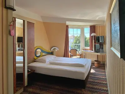 Ein Bett oder Betten in einem Zimmer der Unterkunft Zum Grünen Turm
