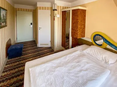 Ein Bett oder Betten in einem Zimmer der Unterkunft Zum Grünen Turm