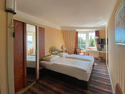 Ein Bett oder Betten in einem Zimmer der Unterkunft Zum Grünen Turm
