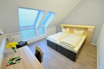 Ein Bett oder Betten in einem Zimmer der Unterkunft Flair Hotel Reuner