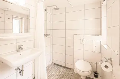 Ein Badezimmer in der Unterkunft Bungis - 28 Ferienhäuser Am Grimnitzsee G3