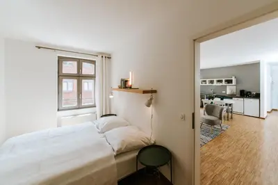 Ein Bett oder Betten in einem Zimmer der Unterkunft Josty Brauerei Appartements