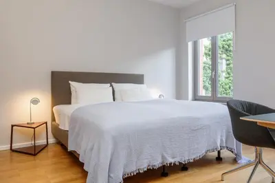 Ein Bett oder Betten in einem Zimmer der Unterkunft Josty Brauerei Appartements
