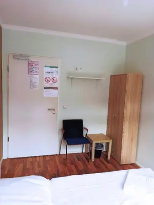Ein Bett oder Betten in einem Zimmer der Unterkunft Puschkin Rooms