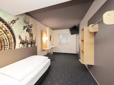Ein Bett oder Betten in einem Zimmer der Unterkunft B&B HOTEL Berlin Genshagen-Nord