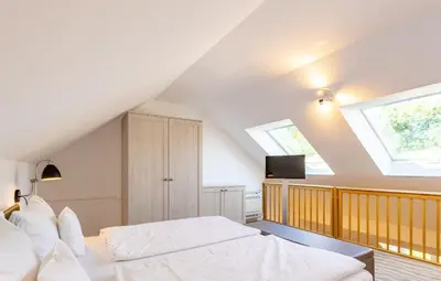 Ein Bett oder Betten in einem Zimmer der Unterkunft Victoria Suites