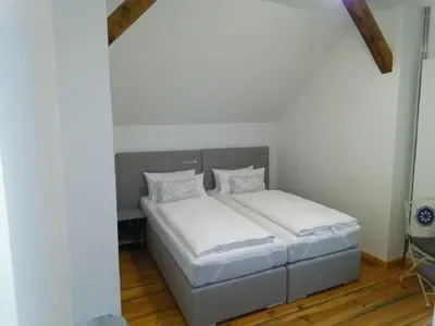 Ein Bett oder Betten in einem Zimmer der Unterkunft Pension-Fürstenberghavel Sans Rival