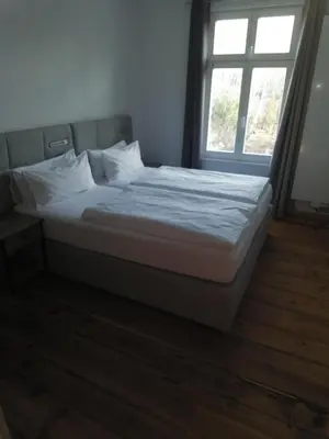 Ein Bett oder Betten in einem Zimmer der Unterkunft Pension-Fürstenberghavel Sans Rival