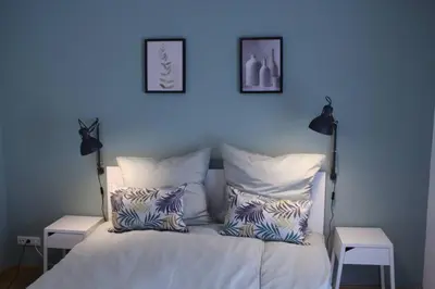 Ein Bett oder Betten in einem Zimmer der Unterkunft FeWo 