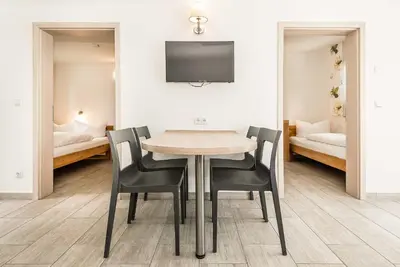 Ein Bett oder Betten in einem Zimmer der Unterkunft Bungis - 28 Ferienhäuser Am Grimnitzsee G8