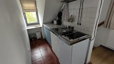 Küche/Küchenzeile in der Unterkunft Ferienwohnung in Peetzig am See