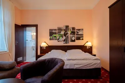 Ein Bett oder Betten in einem Zimmer der Unterkunft Hotel & Restaurant Bergschlösschen