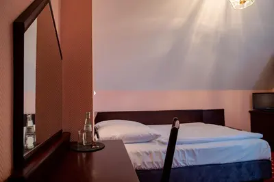 Ein Bett oder Betten in einem Zimmer der Unterkunft Hotel & Restaurant Bergschlösschen