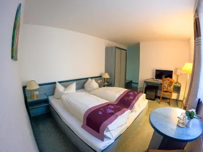 Ein Bett oder Betten in einem Zimmer der Unterkunft Hotel Diana