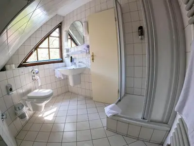 Ein Badezimmer in der Unterkunft Hotel Diana