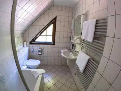 Ein Badezimmer in der Unterkunft Hotel Diana